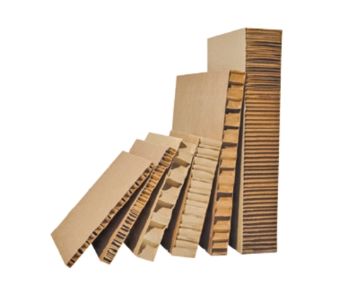 Packaging materials and kraft paper products prepared in a manufacturing facility